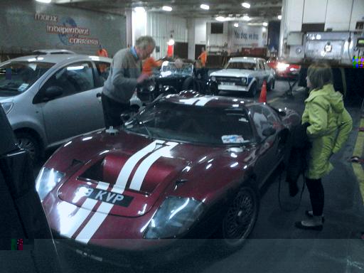 THE SHIP PHYSICALLY SHOOK,AS THIS REPLICA GT 40,RATTLED ONTO THE DECK......JPG