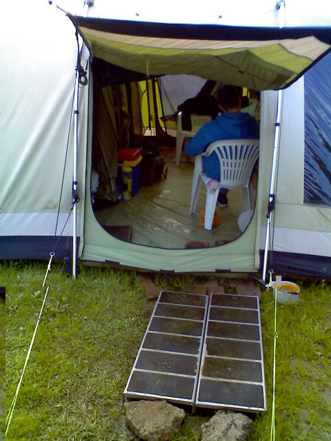 IT HAD PISSED DOWN SO MUCH IN THE NIGHT,WE HAD TO USE THE RAMPS FROM THE TRAILER.....TO GET IN,AND OUT THE TENT....jpg